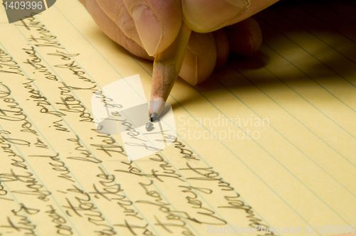 Image of Handwriting with broken pencil point on yellow pad