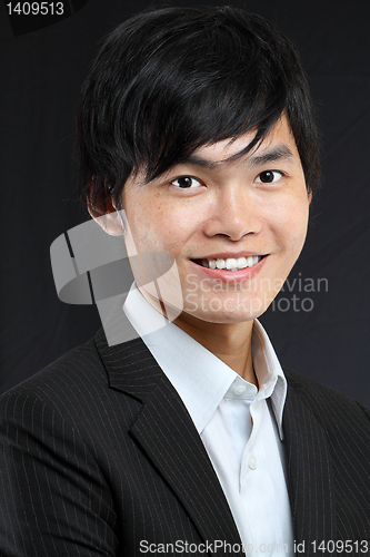 Image of Young asian man in black suit