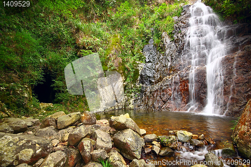 Image of waterfall and mountain cave