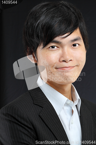 Image of Young asian man in black suit