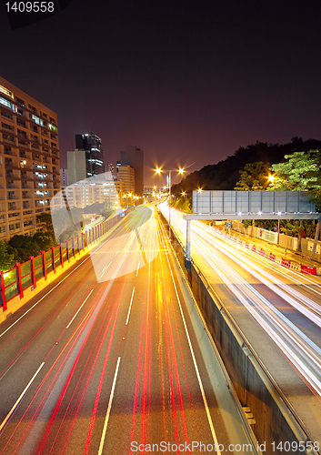 Image of traffic through downtown at night 