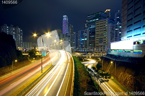 Image of traffic night and big advertising block