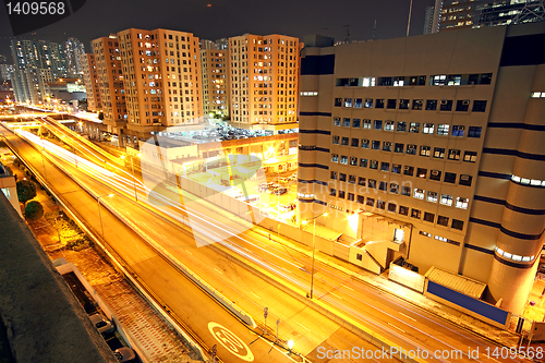 Image of urban landscape at night and through the city traffic 