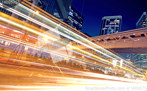 Image of speeding car through the street