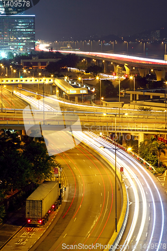 Image of urban landscape at night and through the city traffic 