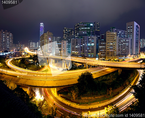 Image of Colorful city night with buildings and bridge