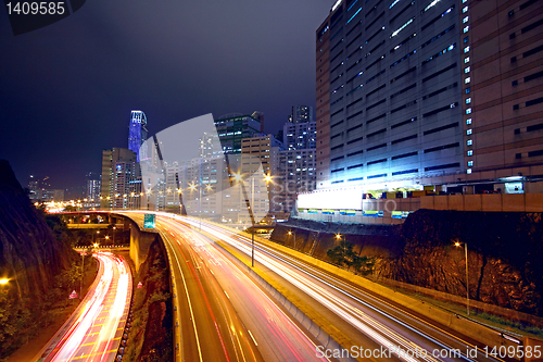 Image of urban area dusk, busy traffic 