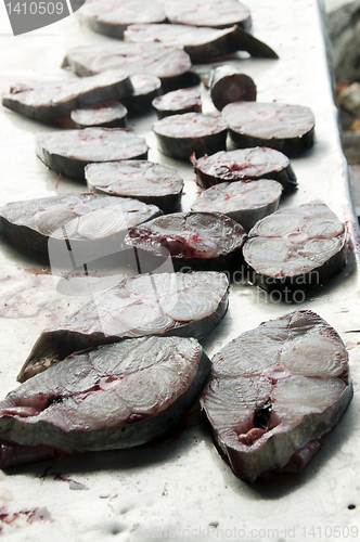 Image of fresh king fish fillets steaks on cutting board
