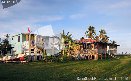 Image of two waterfront houses with palm trees Corn Island Nicaragua