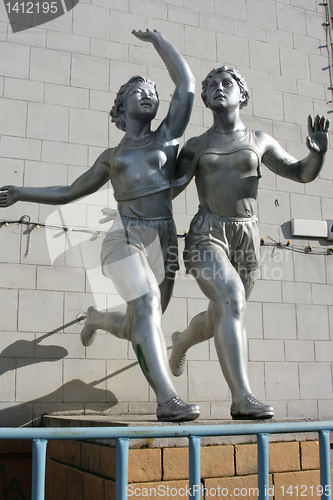 Image of sculpture of  running women