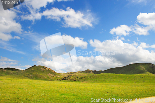 Image of meadow with  mountain landscape