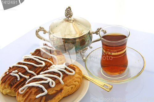 Image of still-life with Pastry  and tea