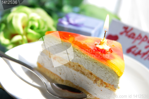 Image of Pastry with candle for birthday