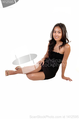 Image of Girl sitting on floor.