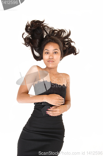 Image of Asian girl lying on floor.