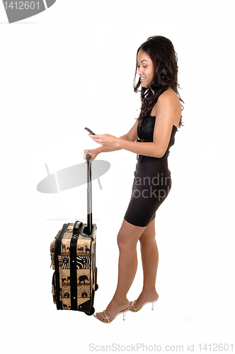 Image of Asian girl with suitcase.