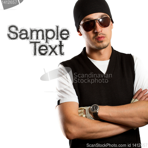 Image of man in glasses and hat looking at camera