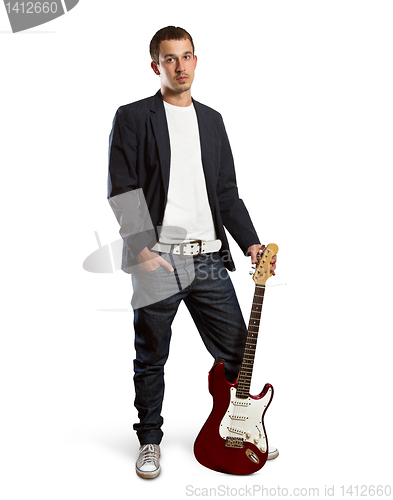 Image of stylish man with guitar looking at camera