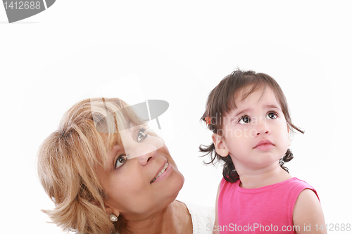 Image of Cute girl and attractive young woman both looking up