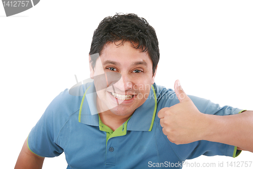 Image of smiling young man with thumbs up on an isolated white background
