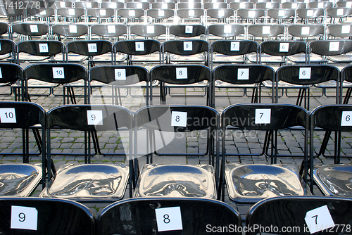 Image of Black plastic chairs 