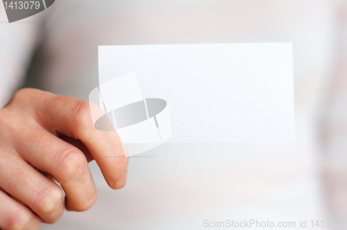 Image of hand and blank paper with copyspace