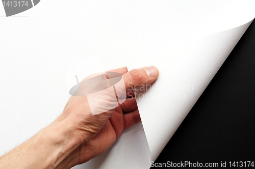 Image of paper and hand