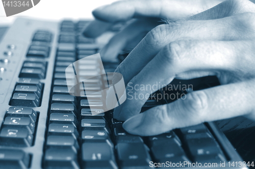 Image of typing hands on keyboard