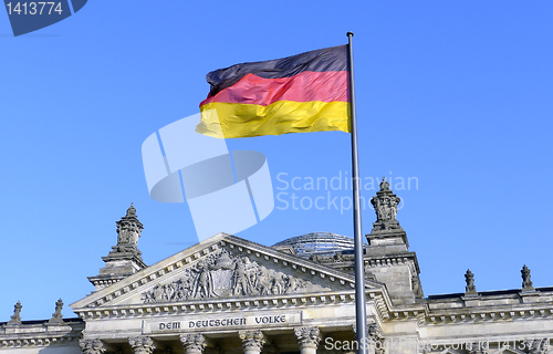 Image of The German flag flying in front of the Reichstag in Berlin