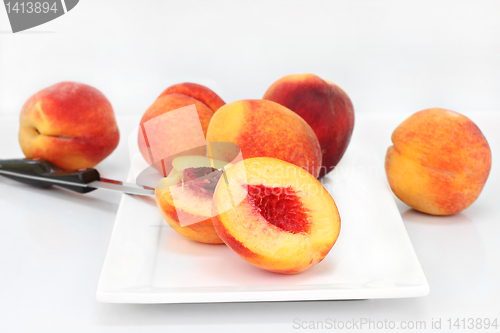 Image of Farm fresh peaches cut and whole