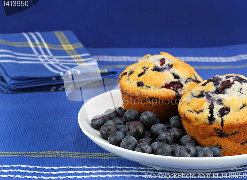 Image of Fresh and healthy bueberries and blueberry muffins