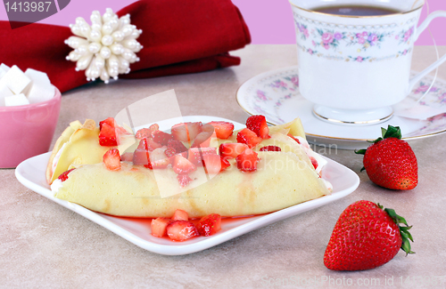 Image of Strawberry Crepes in a feminine table setting.