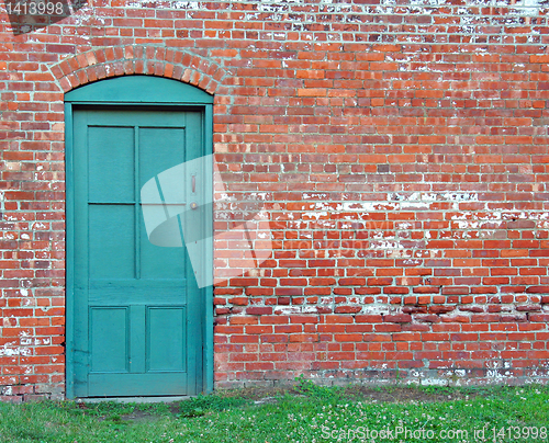 Image of Rustic Green Door in old brick wall.