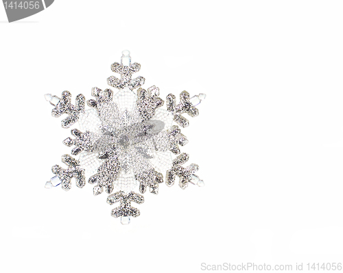 Image of One silver snowflake isolated on white with copy space