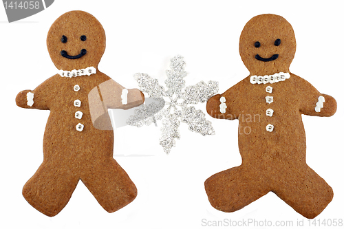 Image of Two Gingerbread Man Cookies Holding a Snowflake