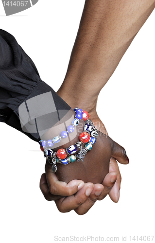 Image of Close up of couple holding hands 