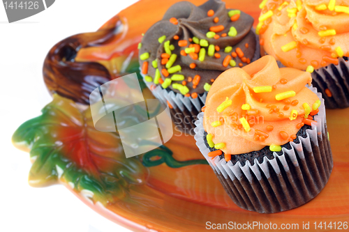 Image of Autumn cupcakes on Pumpkin plate.