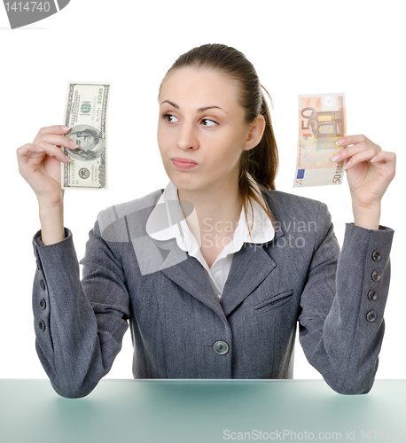 Image of business woman holding a currency