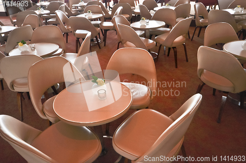 Image of leather chairs and wooden tables