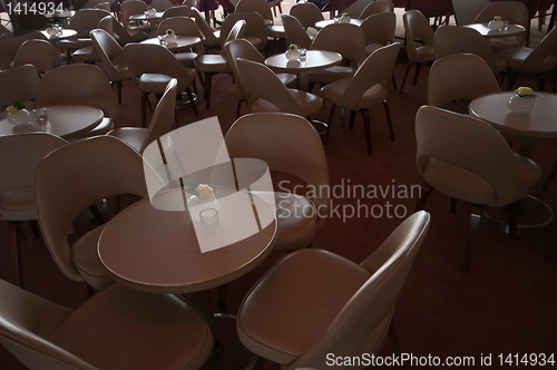 Image of leather chairs and wooden tables