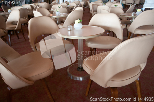 Image of leather chairs and wooden tables