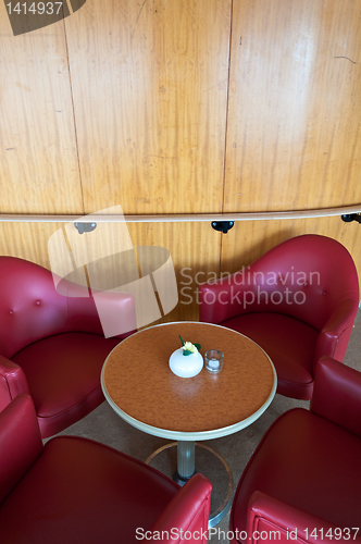 Image of leather chairs and wooden tables