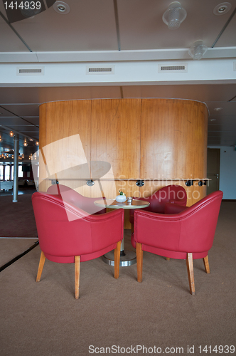 Image of leather chairs and wooden tables