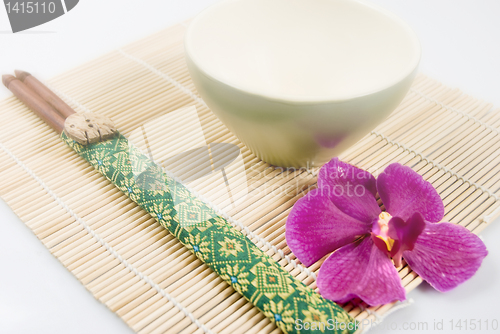 Image of Chopsticks, Bowl, and Orchid