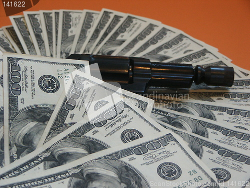 Image of Money and a revolver