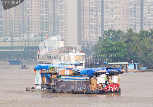 Image of Small cargo vessel on Saigon River