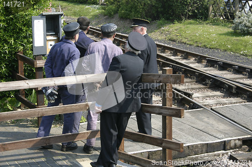 Image of men train watching