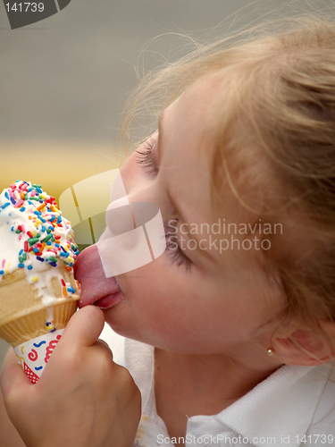 Image of girl licking ice cream cone