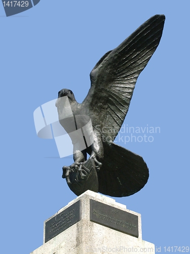 Image of Proud eagle statue against blue sky