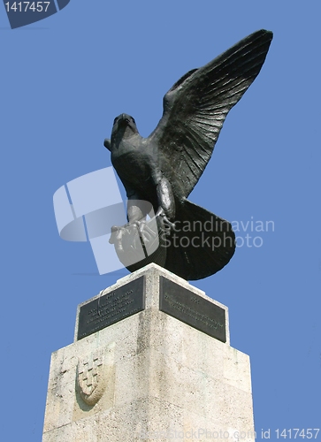 Image of Proud eagle statue against blue sky
